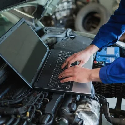 depositphotos 24096043 stock photo auto mechanic using laptop
